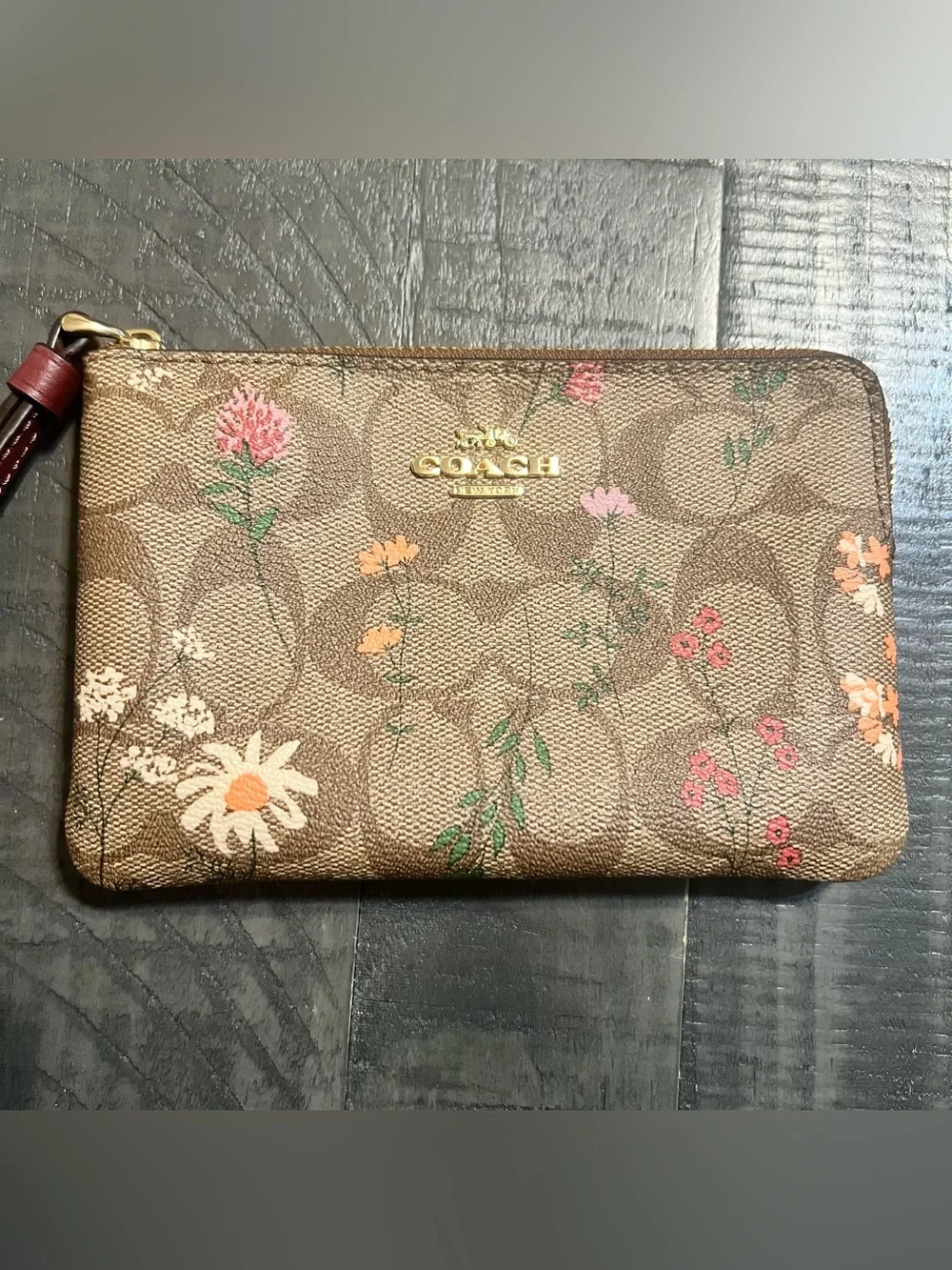 COACH Brown Floral Signature Wristlet with Burgundy Strap